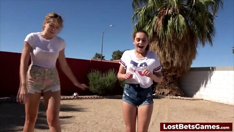 Three players in a strip version of the volleyball game